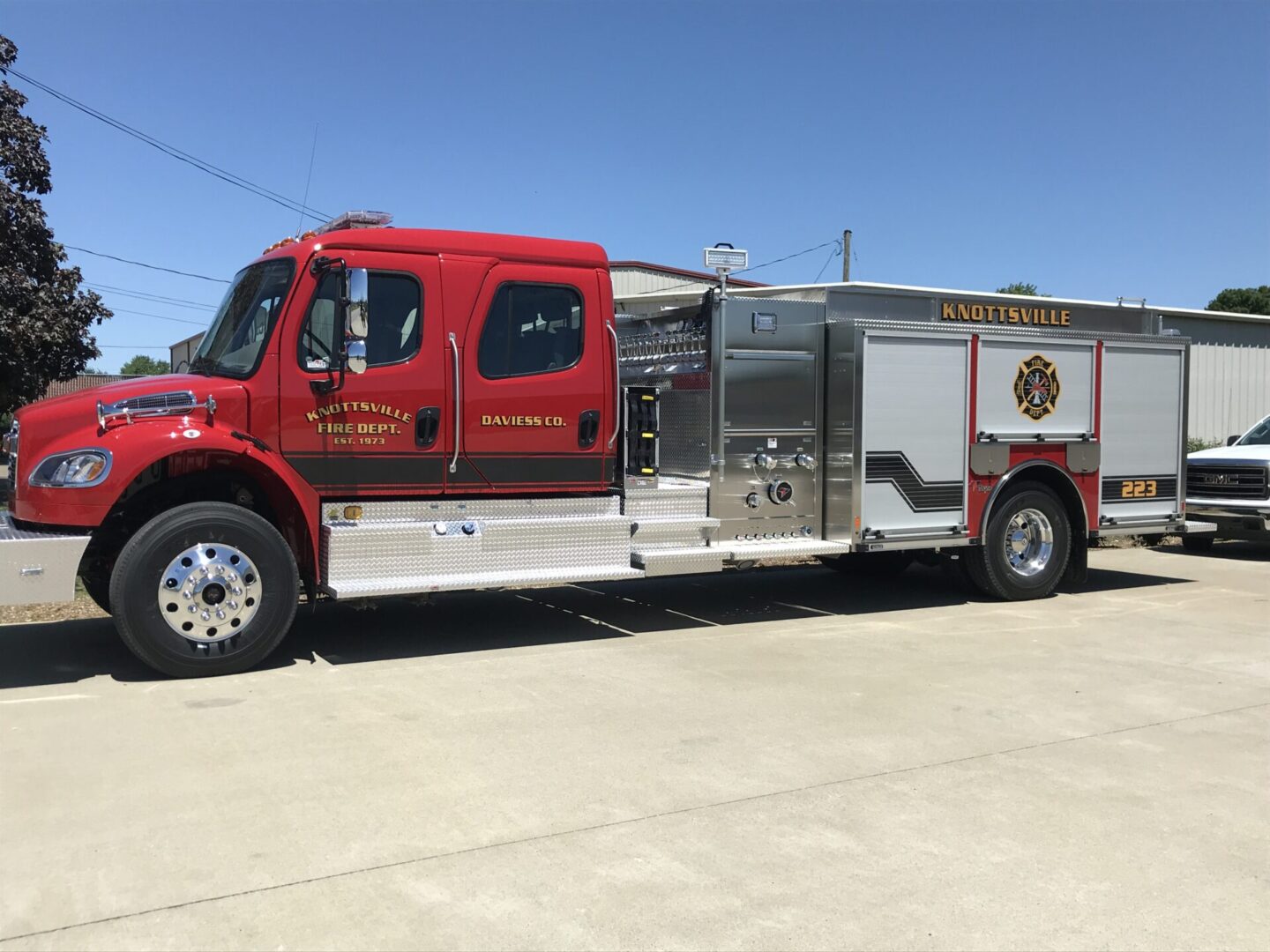 A red fire truck parked in the parking lot.