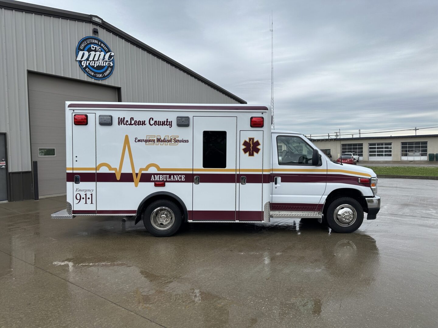 A white ambulance parked in front of a building.