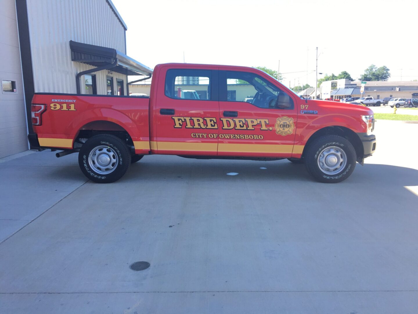 A red fire truck parked in front of a building.