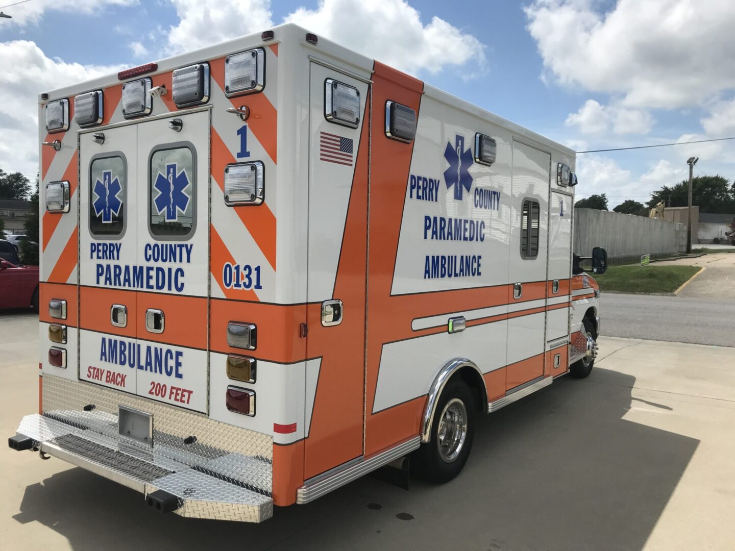 A large ambulance parked on the side of the road.