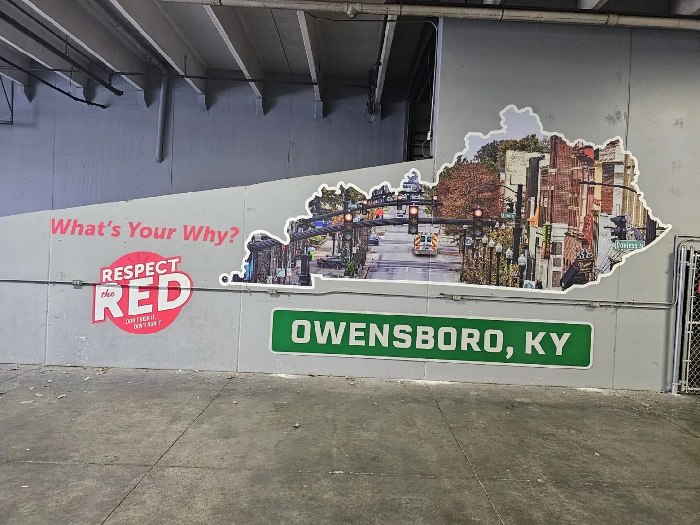 A mural of owensboro, ky on the side of a building.