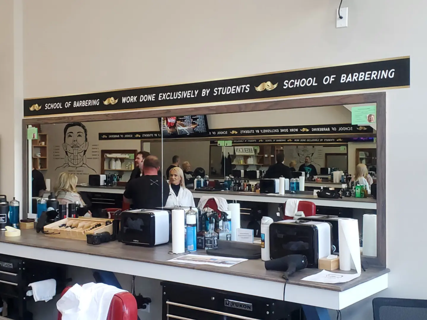 A group of people sitting at a counter.