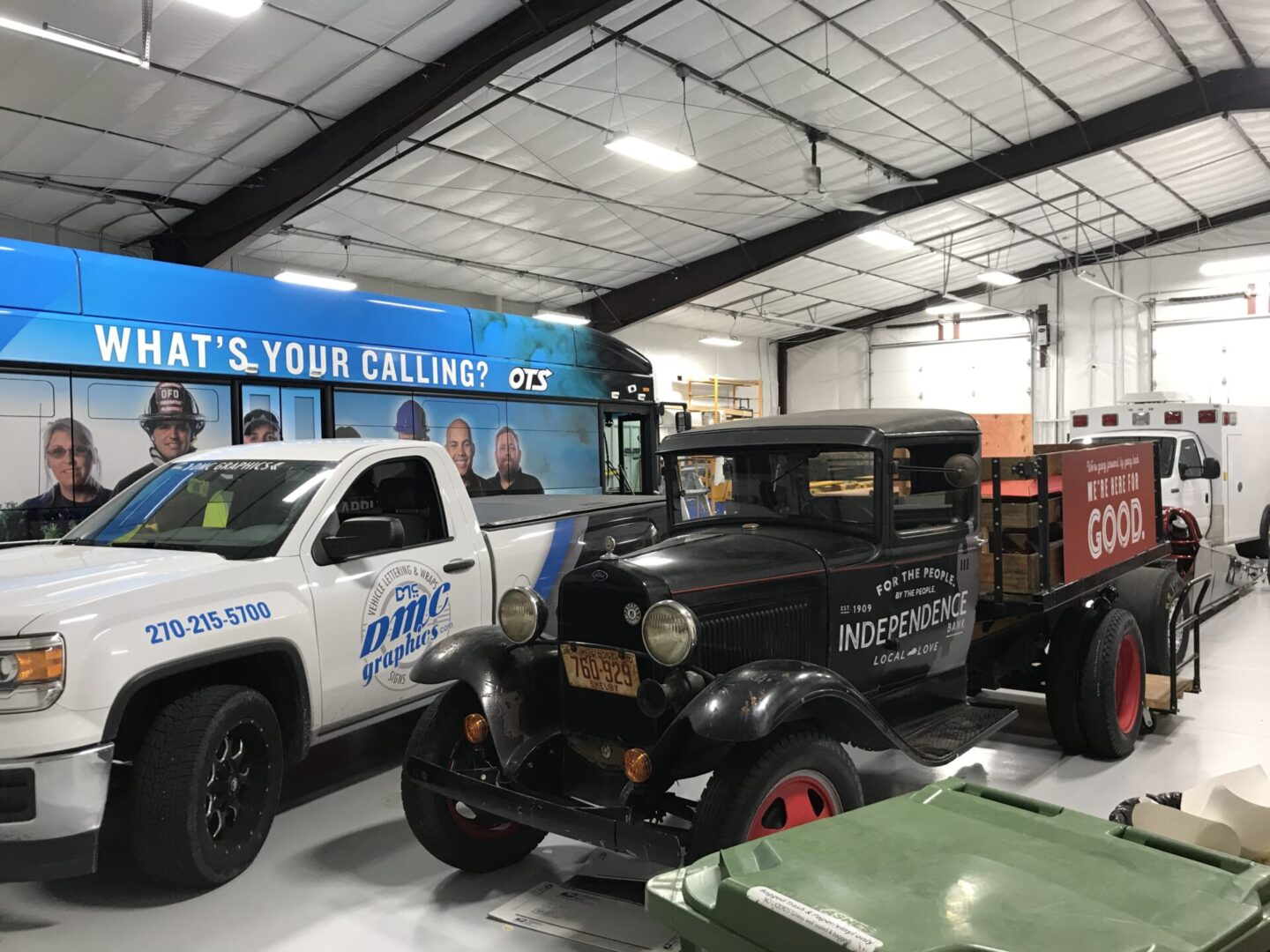 A truck and other vehicles in a building.