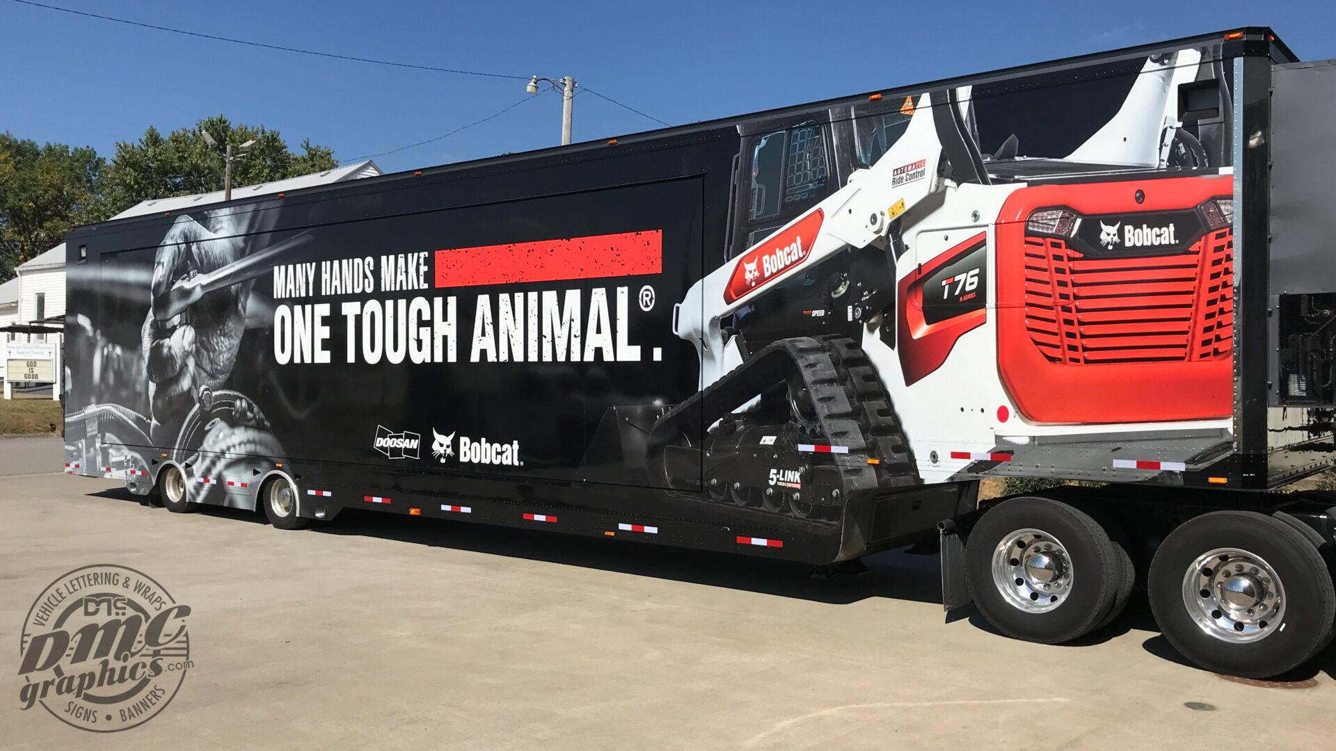 A large truck with a trailer attached to it.