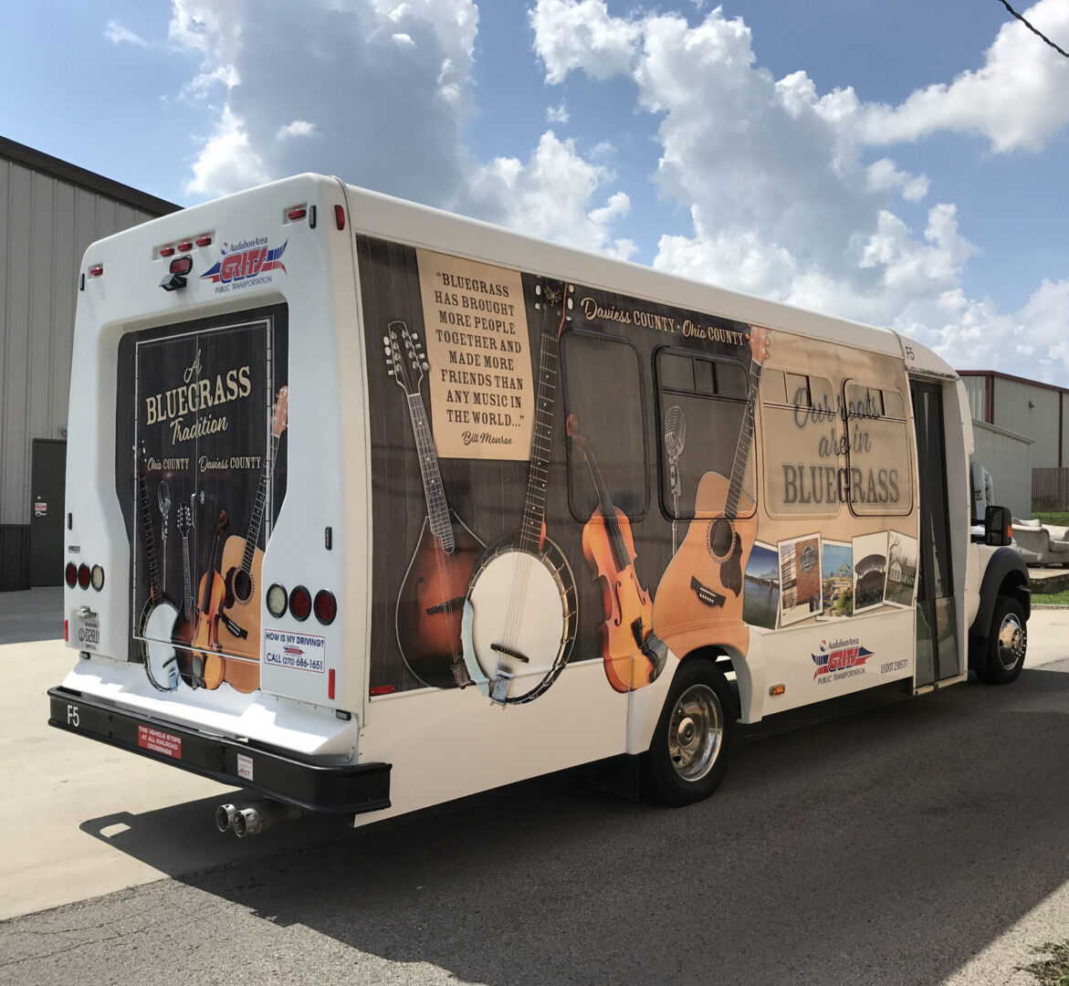 A bus with advertising on the side of it.