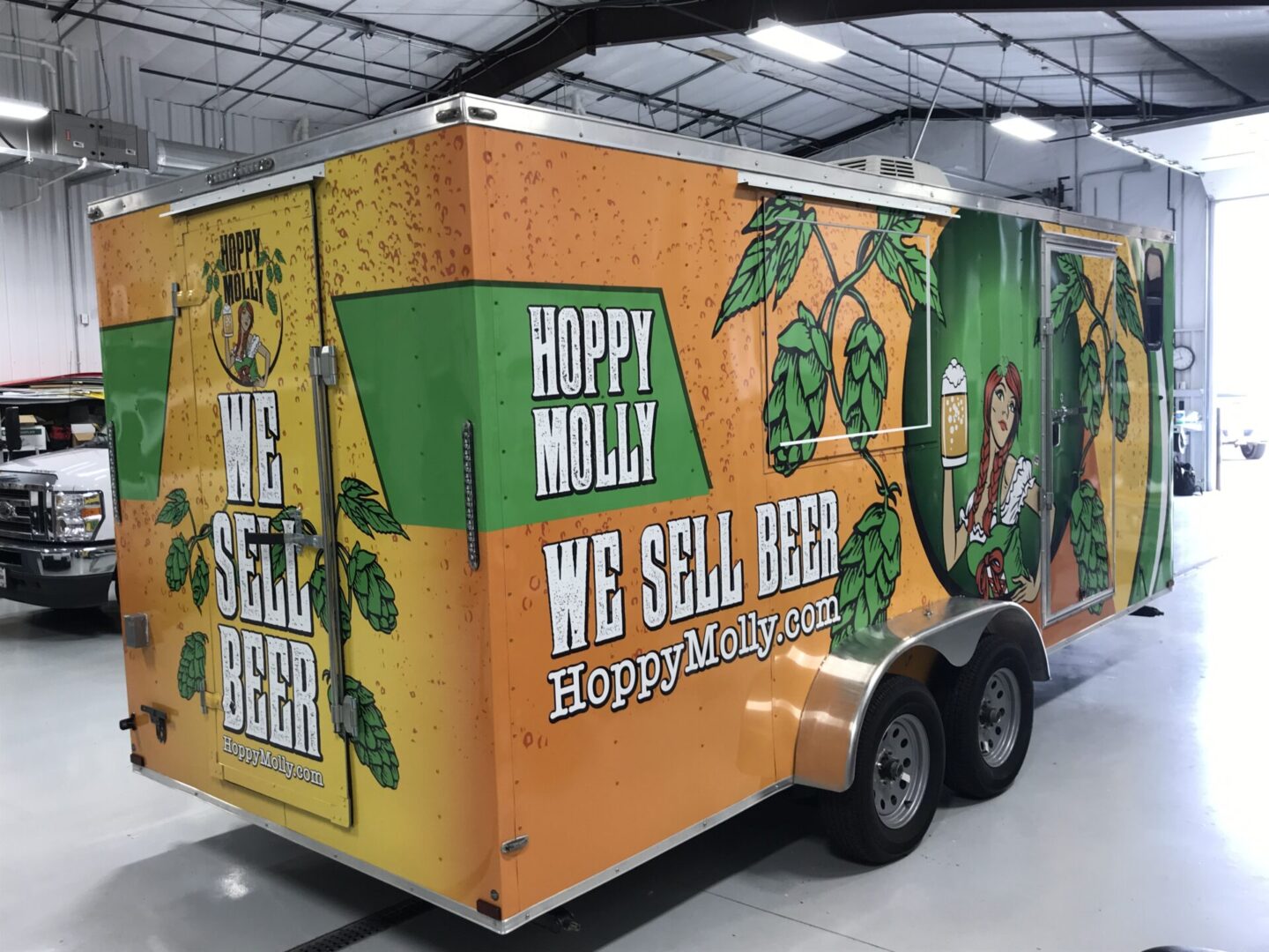 A trailer with a picture of hops on it.