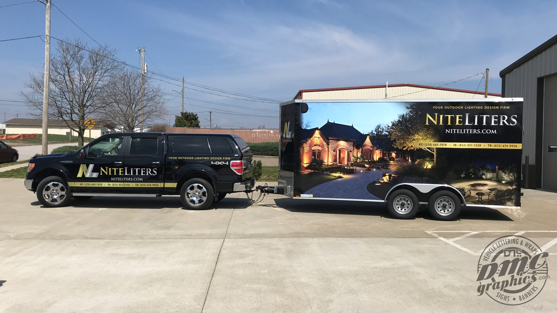 A truck and trailer with a painting on the side of it.