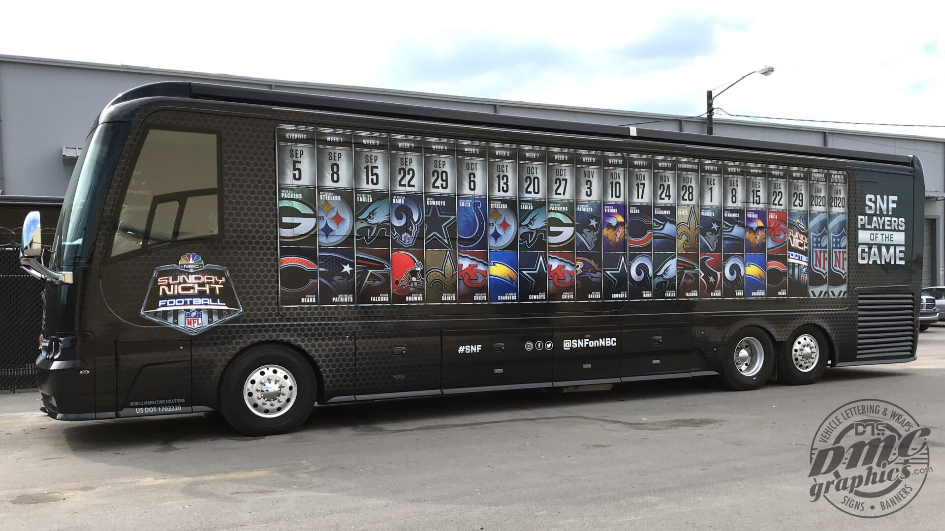 A large bus with many different images on the side.