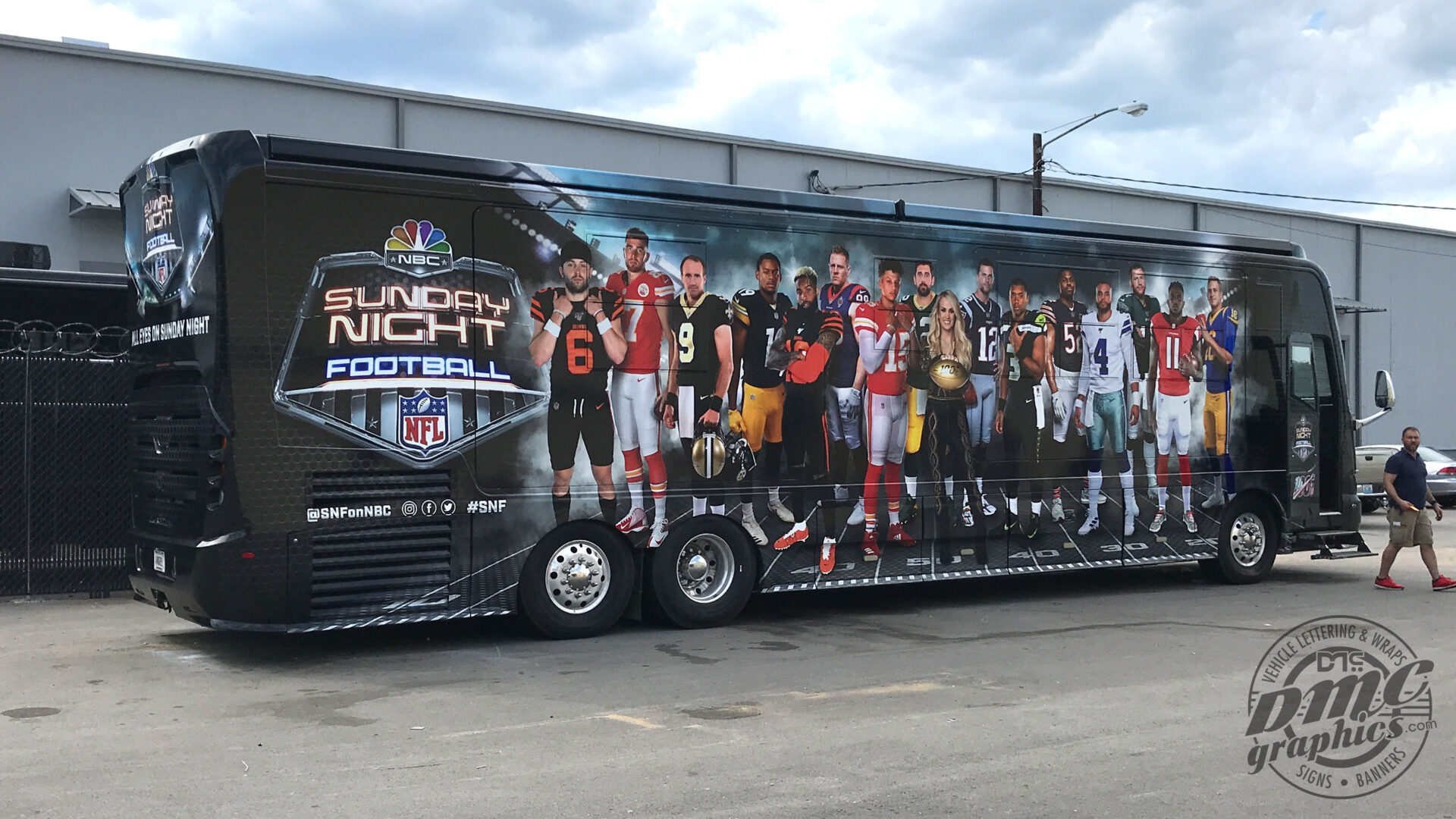 A large bus with the nfl team 's players on it.