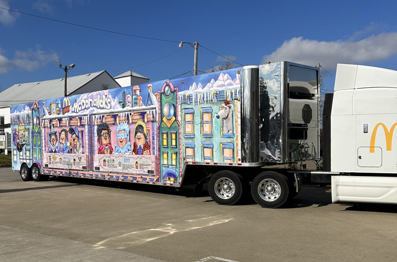 A large truck with many pictures on it