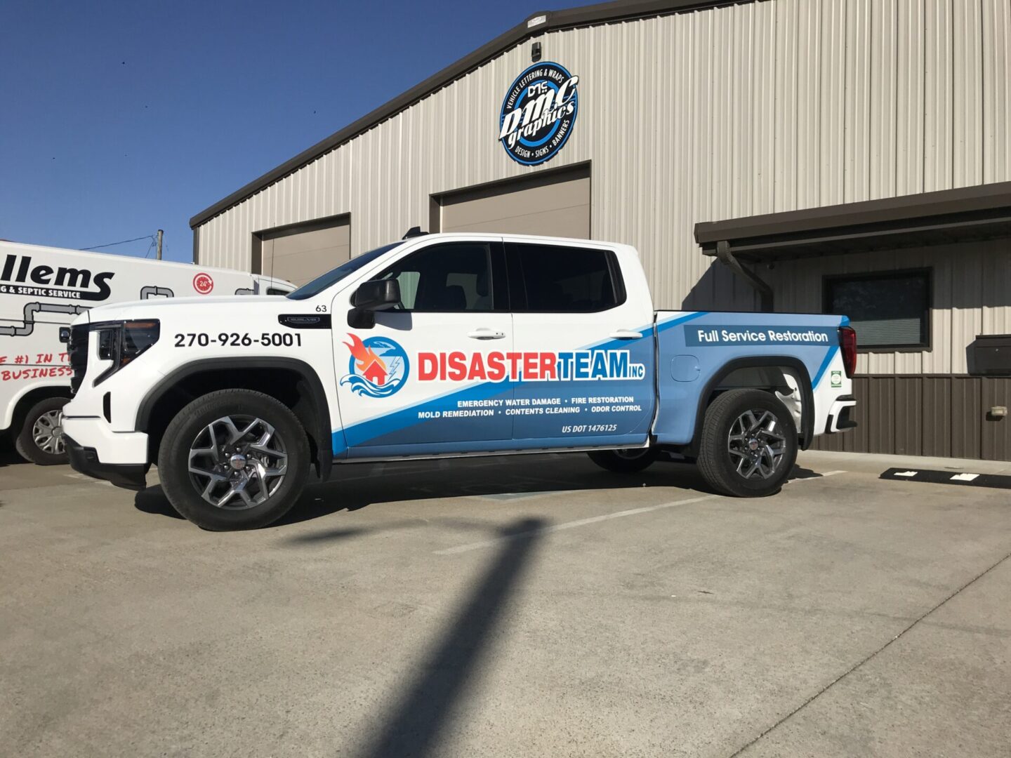 A truck parked in front of a building with the words disaster relief on it.