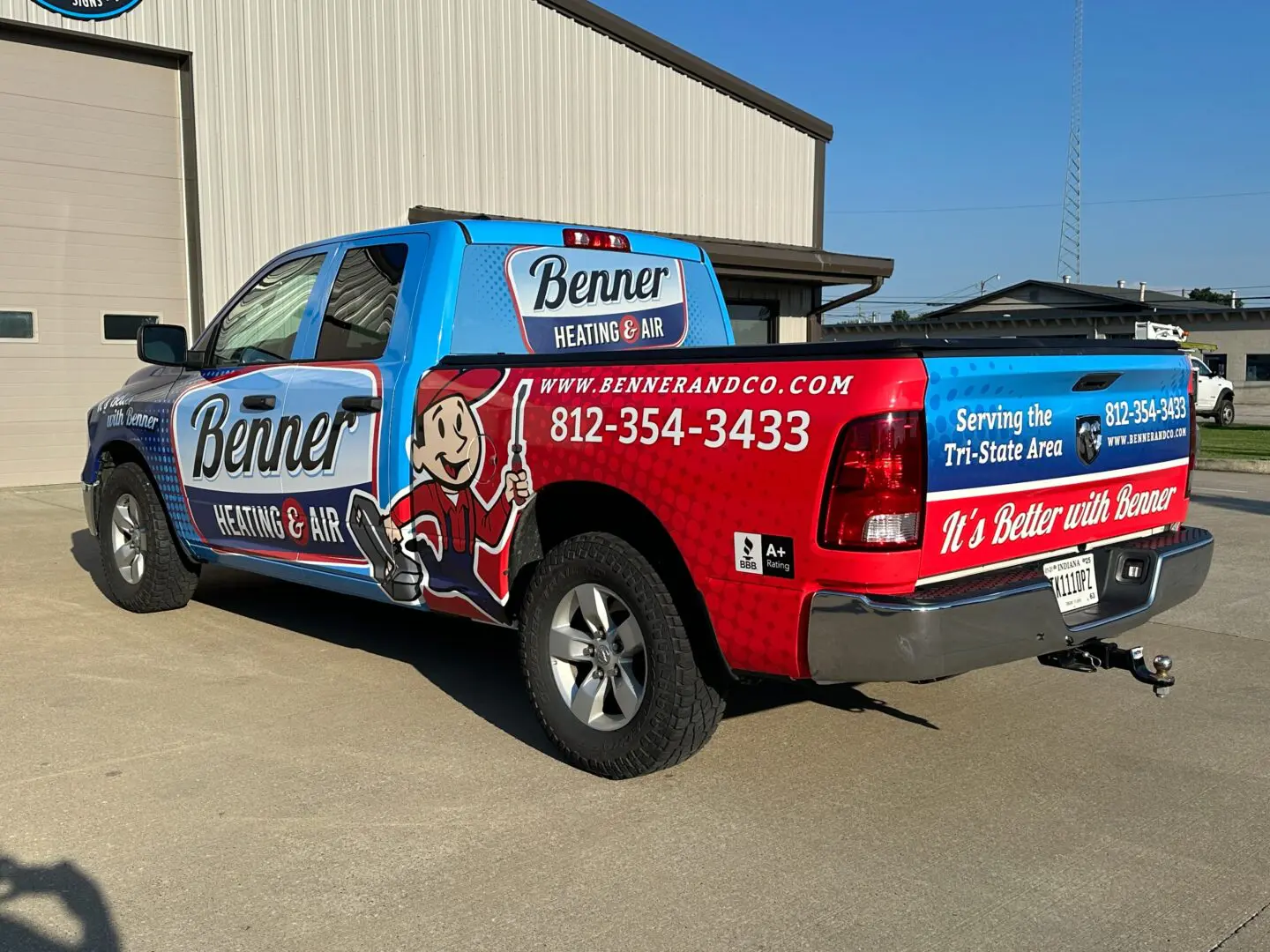 A truck with a large wrap on the back of it.