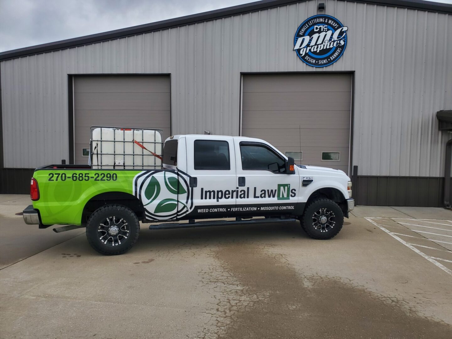 A truck with the words imperial lawn care on it.