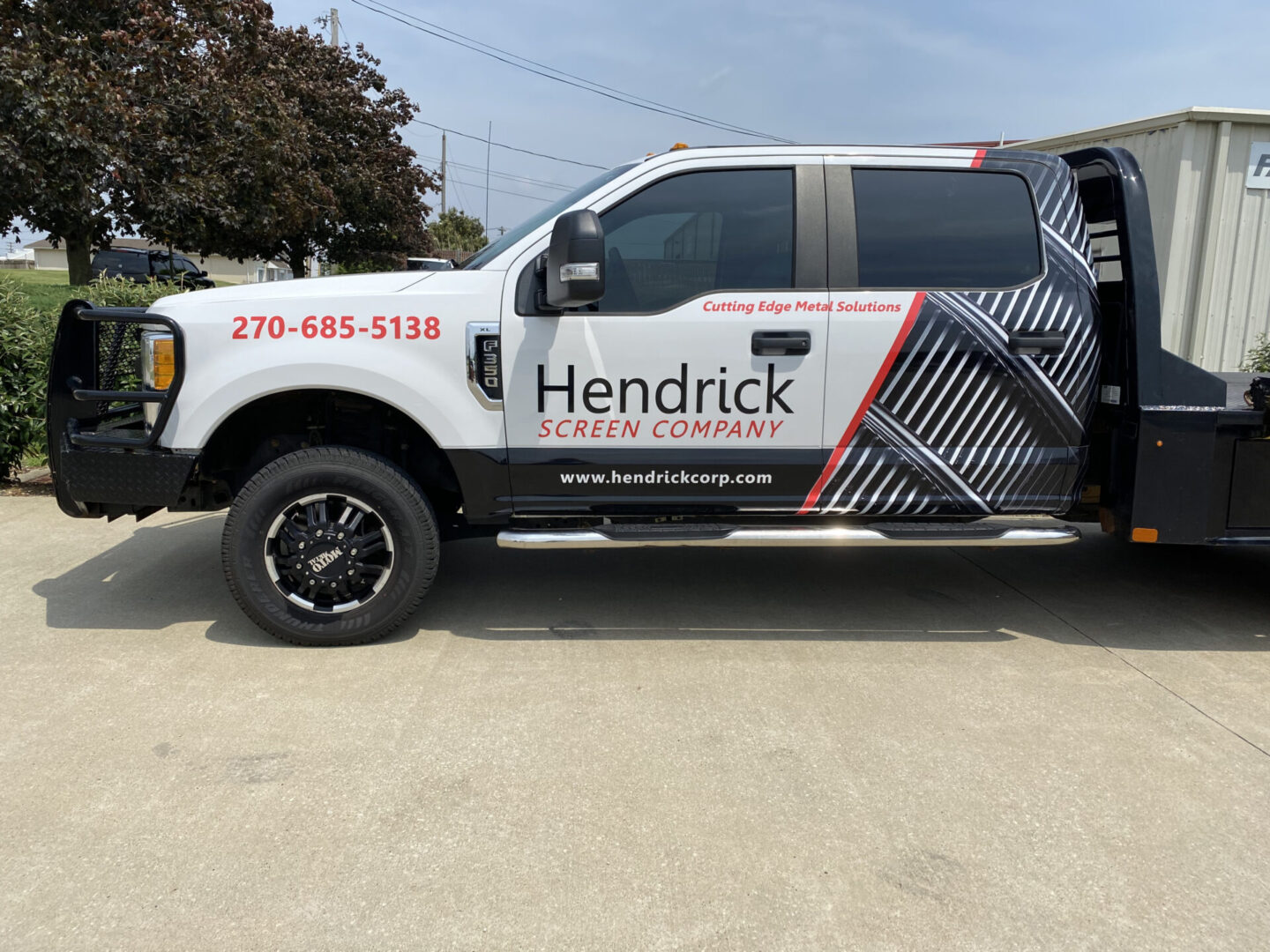 A truck with the name hendrick truck company on it.