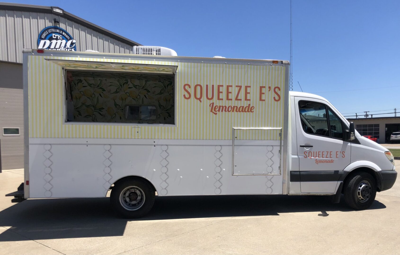 A food truck parked in the parking lot.