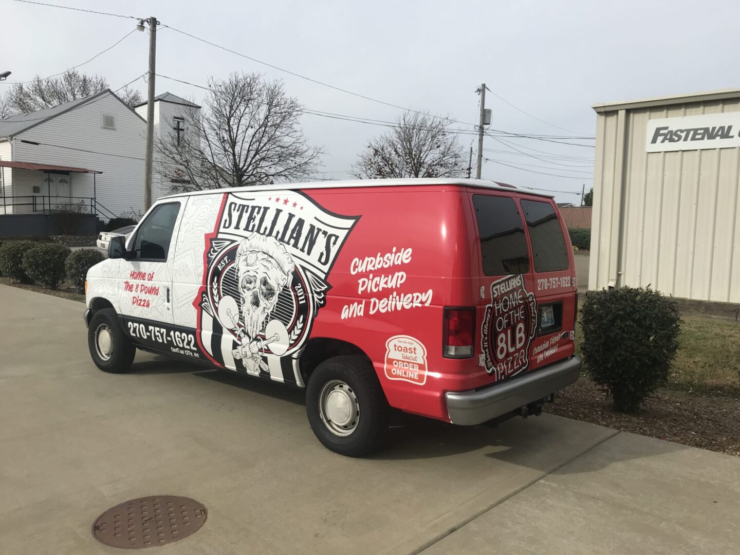 A van with a dog on the side of it