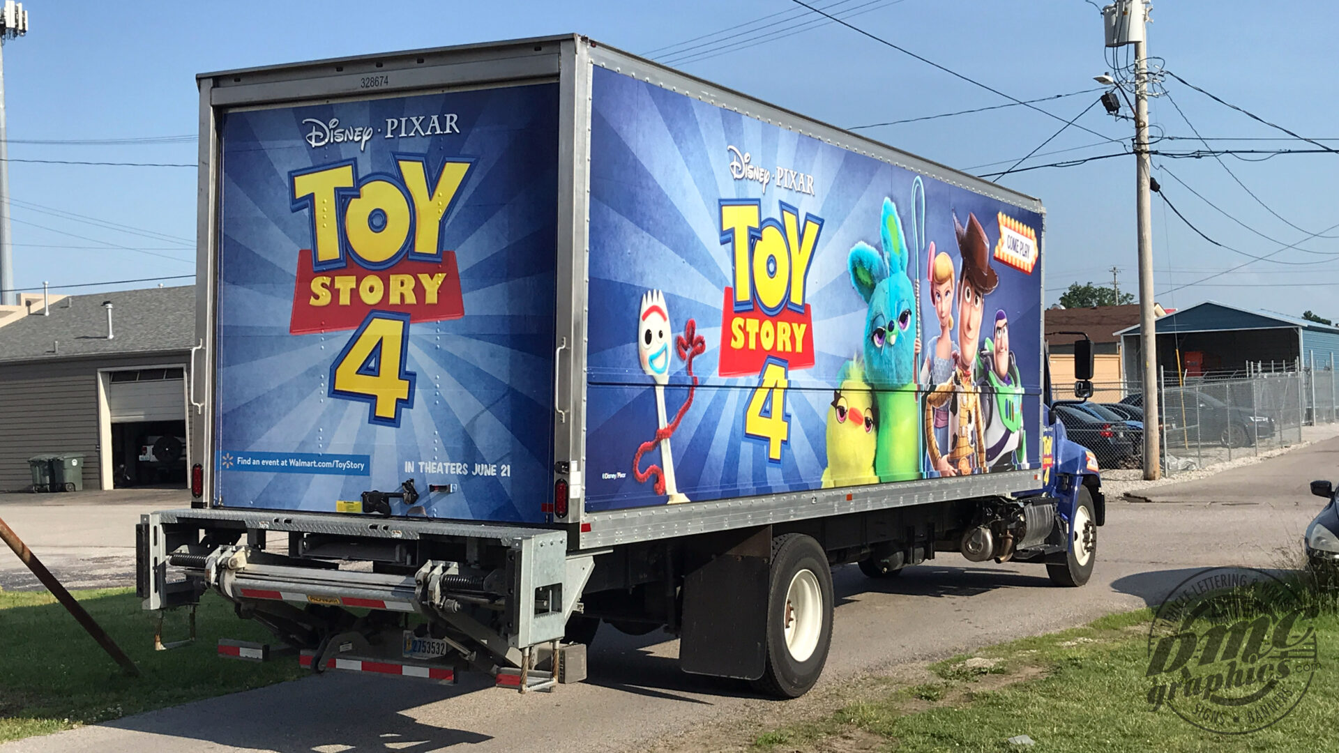 A toy story 4 trailer parked on the side of the road.