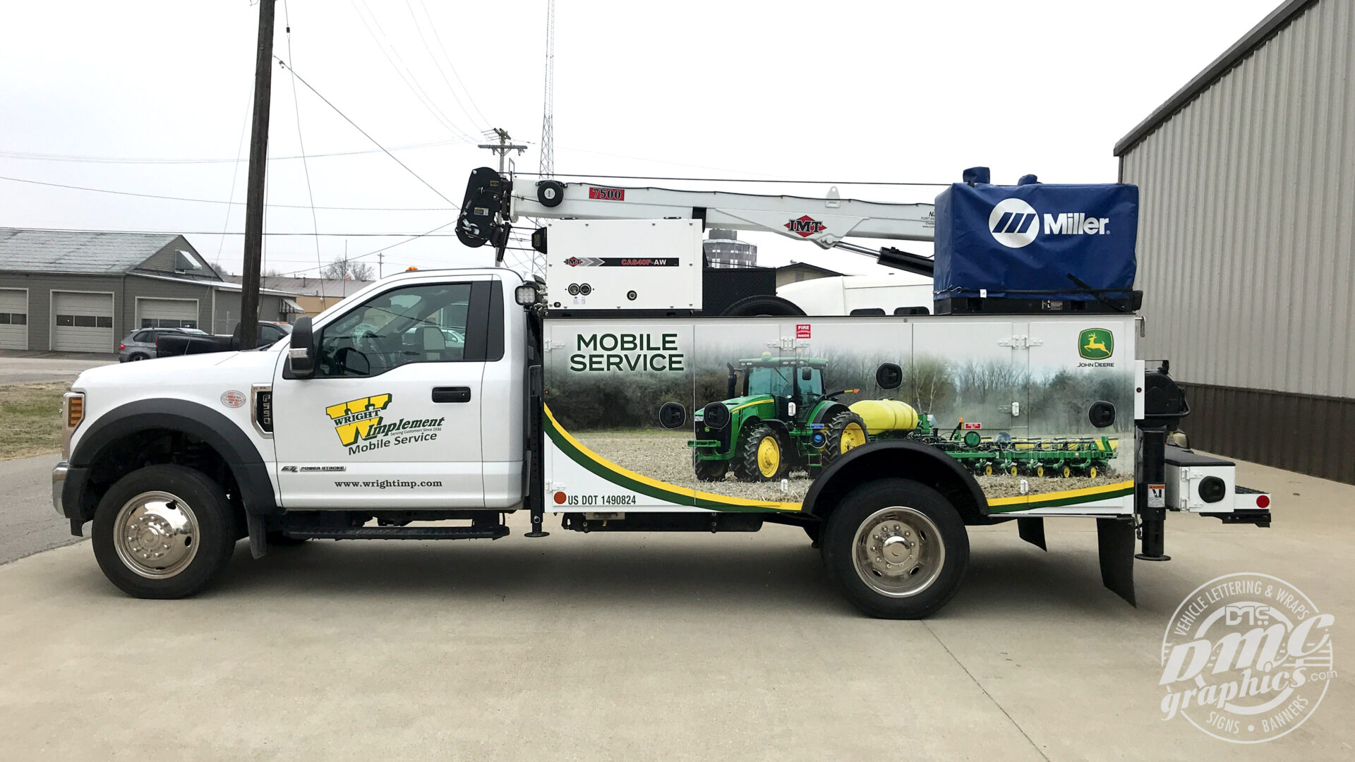 A truck with a large sign on the side of it.