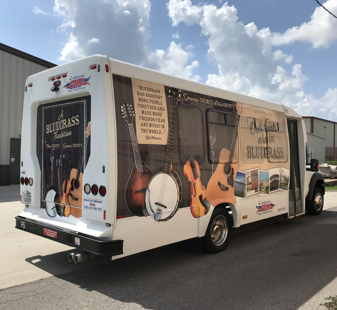 A bus with advertising on the side of it.