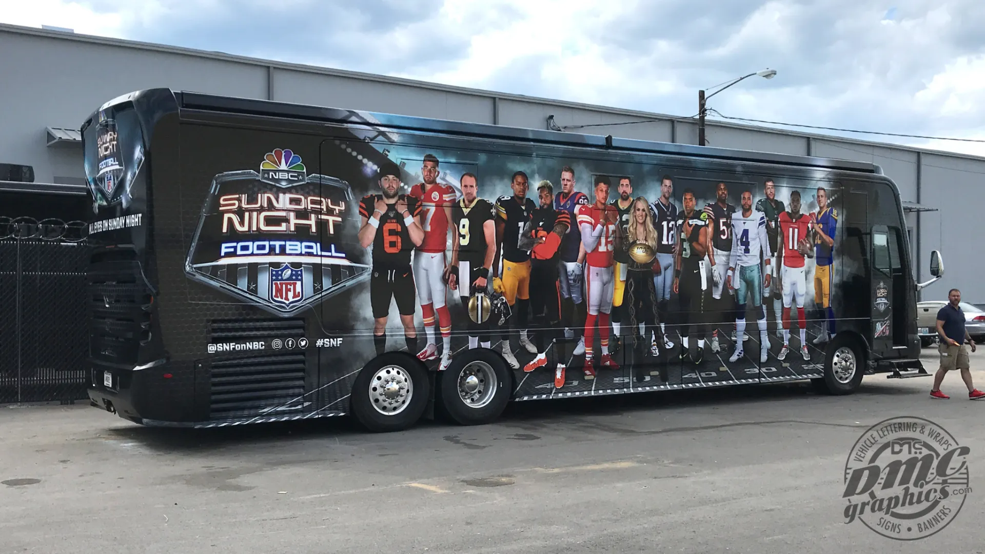 A bus with the nfl team 's photo on it.