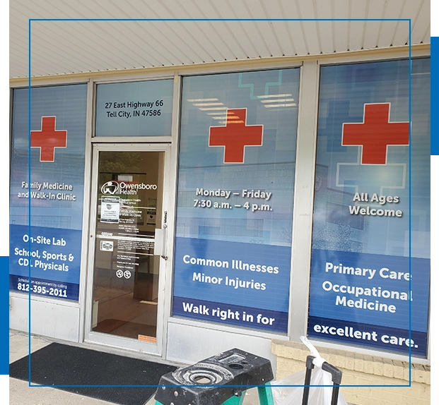 A large window with medical signs on it.